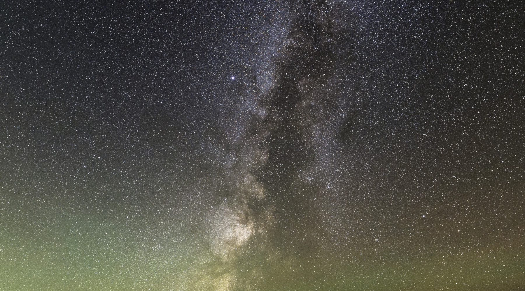 Milky Way rising over a dark mountain ridge, Rocky Mountain National Park