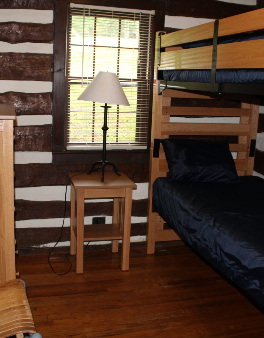 Log cabin bedroom with bunk beds